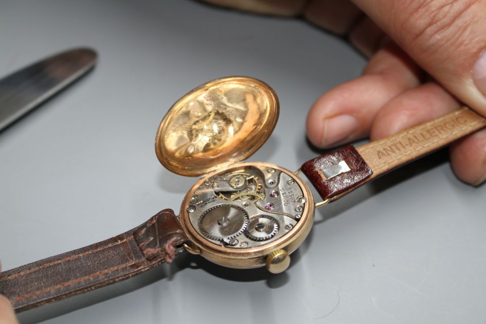 A gentlemans 1920s 9ct. gold manual wind wristwatch, with case back inscription.